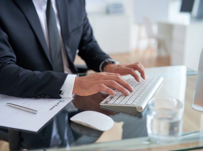 unrecognizable-businessman-typing-keyboard-office unrecognizable-businessman-typing-keyboard-office